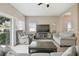 Living room with gray sofas and sliding glass doors at 1115 Andrew Aviles Cir, Tampa, FL 33619