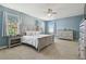 Main bedroom with king-size bed and dresser at 1115 Andrew Aviles Cir, Tampa, FL 33619