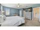 Main bedroom with king-size bed and en-suite bathroom at 1115 Andrew Aviles Cir, Tampa, FL 33619