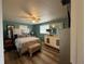 Main bedroom with a large bed and dresser at 12400 Park Blvd # 321, Seminole, FL 33772