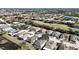 Community aerial view featuring lush landscaping, ponds, and well-maintained homes at 1330 Misty Greens Dr, Sun City Center, FL 33573