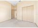 Spacious bedroom featuring neutral walls, carpet, and a closet for ample storage at 1330 Misty Greens Dr, Sun City Center, FL 33573