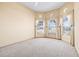 Bright bedroom with lots of natural light and neutral carpeting at 1330 Misty Greens Dr, Sun City Center, FL 33573