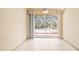 Empty dining room with sliding glass doors leading to a patio at 1330 Misty Greens Dr, Sun City Center, FL 33573