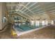 Indoor swimming pool with ample space and seating area at 1330 Misty Greens Dr, Sun City Center, FL 33573