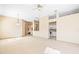 Expansive living room featuring neutral paint, ceiling fan, and access to the kitchen at 1330 Misty Greens Dr, Sun City Center, FL 33573