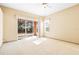 Main bedroom features a sliding glass door to the yard, a window, and a ceiling fan at 1330 Misty Greens Dr, Sun City Center, FL 33573