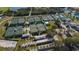 Aerial view of community tennis courts with surrounding landscape at 1330 Misty Greens Dr, Sun City Center, FL 33573