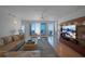 Spacious living room with ocean view and large TV at 1350 Gulf Blvd # 604, Clearwater, FL 33767