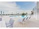 Relaxing pool area with lounge chairs and beach access at 1350 Gulf Blvd # 604, Clearwater, FL 33767