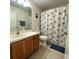 Bathroom with wood vanity and shower/tub combo at 1707 Magnolia Landings Ct, Sun City Center, FL 33573