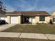 Charming one-story house featuring a brown roof and a neatly landscaped front yard at 1915 Crown Park Dr, Valrico, FL 33594