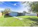 Spacious backyard with a screened porch at 2009 Windsor Way, Tampa, FL 33619