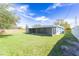 Spacious backyard with a screened porch at 2009 Windsor Way, Tampa, FL 33619