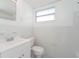 Clean bathroom with white fixtures and tiled walls at 2009 Windsor Way, Tampa, FL 33619