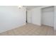 Simple bedroom with tile floors and a built-in closet at 2009 Windsor Way, Tampa, FL 33619