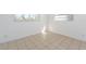 Well-lit bedroom with tile floors and multiple outlets at 2009 Windsor Way, Tampa, FL 33619
