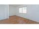 Simple bedroom with wood floors and a window with blinds at 2009 Windsor Way, Tampa, FL 33619