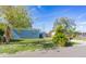 Newly painted light blue home with a spacious yard and driveway at 2009 Windsor Way, Tampa, FL 33619