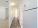 Clean hallway with tiled floor and access to rooms at 2009 Windsor Way, Tampa, FL 33619