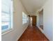Long hallway with tile floors and access to other rooms at 2009 Windsor Way, Tampa, FL 33619