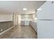 Modern kitchen with gray cabinets and white appliances at 2009 Windsor Way, Tampa, FL 33619