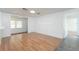 Living room with light wood floors and large window at 2009 Windsor Way, Tampa, FL 33619