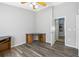 Spacious bedroom with wood-look flooring and built-in desk at 24745 Portofino Dr, Lutz, FL 33559