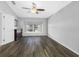 Primary bedroom with large window, ceiling fan, and ample space at 24745 Portofino Dr, Lutz, FL 33559