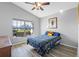 Bedroom with wood-look flooring and a ceiling fan at 24745 Portofino Dr, Lutz, FL 33559