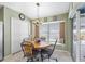 Bright breakfast nook features a round table and chairs, access to a pool view at 24745 Portofino Dr, Lutz, FL 33559