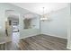 Open dining room with hardwood floors and arched openings at 24745 Portofino Dr, Lutz, FL 33559