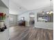 Dining room with hardwood floors, chandelier, and views into kitchen at 24745 Portofino Dr, Lutz, FL 33559