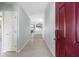 Bright entryway with tile flooring, neutral walls, and a view to the living area at 24745 Portofino Dr, Lutz, FL 33559