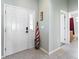 Clean entryway with white door and tile flooring at 24745 Portofino Dr, Lutz, FL 33559