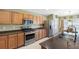 Modern kitchen with stainless steel appliances and granite countertops at 24745 Portofino Dr, Lutz, FL 33559
