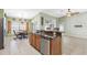 Kitchen features breakfast nook and an island with seating at 24745 Portofino Dr, Lutz, FL 33559