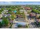 Aerial view showcasing a house and neighborhood, cityscape in the distance at 2515 N Howard Ave, Tampa, FL 33607