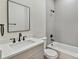 Bathroom boasts a bathtub, modern vanity, and updated fixtures at 2515 N Howard Ave, Tampa, FL 33607