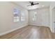 Bedroom with wood floors, multiple windows and exterior access at 2515 N Howard Ave, Tampa, FL 33607