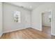 Spacious bedroom with hardwood floors and exterior access at 2515 N Howard Ave, Tampa, FL 33607