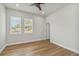 Well lit bedroom with wood floors and access to a bathroom at 2515 N Howard Ave, Tampa, FL 33607