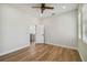 Spacious bedroom with wood floors and access to the kitchen at 2515 N Howard Ave, Tampa, FL 33607