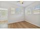 Spacious bedroom with wood floors and multiple windows at 2515 N Howard Ave, Tampa, FL 33607
