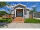 Charming house with a teal front door and welcoming porch at 2515 N Howard Ave, Tampa, FL 33607