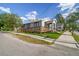 Charming bungalow with a gray exterior, ramp access, and well-manicured lawn at 2515 N Howard Ave, Tampa, FL 33607