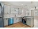 Modern kitchen with stainless steel appliances and light gray cabinets at 2515 N Howard Ave, Tampa, FL 33607