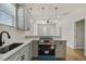 Modern kitchen with gray cabinets and a breakfast bar at 2515 N Howard Ave, Tampa, FL 33607