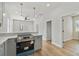 Modern kitchen features gray cabinets, stainless steel appliances, and an island at 2515 N Howard Ave, Tampa, FL 33607
