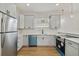 Modern kitchen with gray cabinets, quartz countertops, and teal dishwasher at 2515 N Howard Ave, Tampa, FL 33607